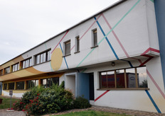 La facciata dello stabilimento della cooperativa e' stata affrescata dall'artista Luigi Veronesi.