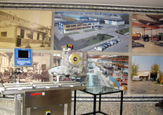 Sulla parete, immagini che raccontano la lunga storia (sessant'anni dalla fondazione nel 2009) della Coop Bilanciai.