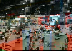 Stand Gruppo Sacmi. Nell'ambito della Divisione Packaging del Gruppo Sacmi Imola, Inpak Imola progetta, produce e vende macchine e sistemi completi di imballaggio e palettizzazione.