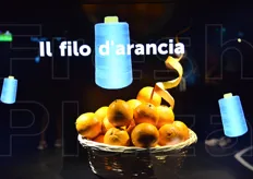 "Monitor dedicato all'esperienza della catanese "Orange Fiber", che ha creato un tessuto partendo dalle arance come materia prima."